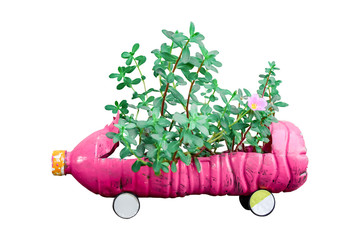 Flowers in Children's car made of plastic bottles Isolated on white background. with clipping path.