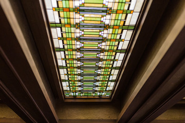 Highly decorative ceiling light with dark wood beams