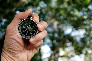 Black compass in natural scenery