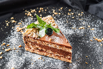 cake with cream on the black background