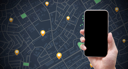 mobile phone mockup on hand in city map background and pin icon