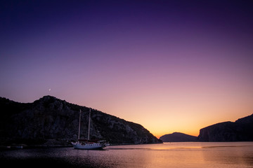 Sailing yacht in the bay at sunset. Greece. Khalkidhiki