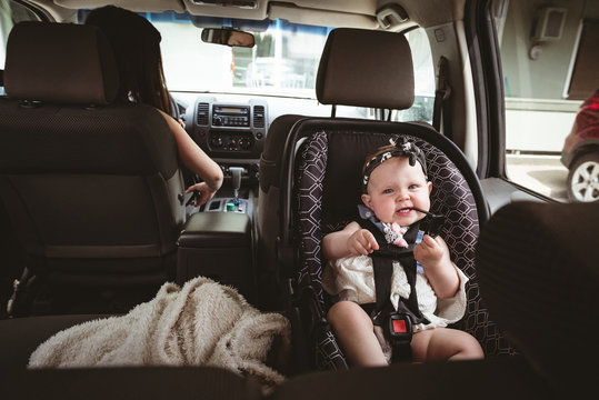 Baby sitting in child safety seat