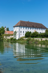Landscape on the Rhine with former monastery building of the Rhe