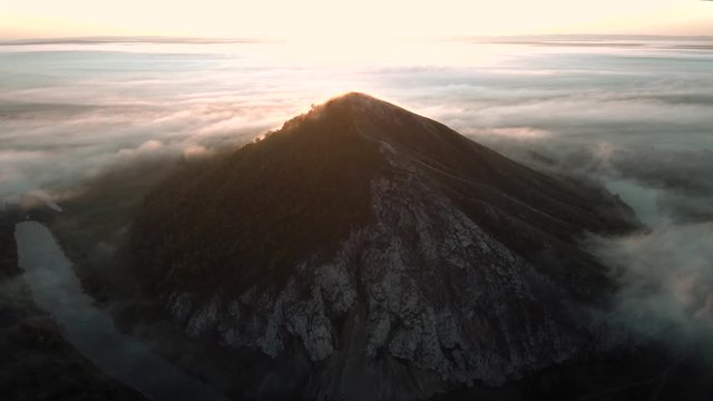 The remain of the reef of the ancient sea, composed of limestone - shikhan Yuraktau. Indian summer in the floodplain of the Belaya River. Aerial view.