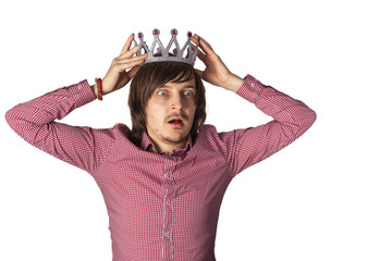 man with long hair in the crown. Isolate on a white background. Amazed man won a beauty contest