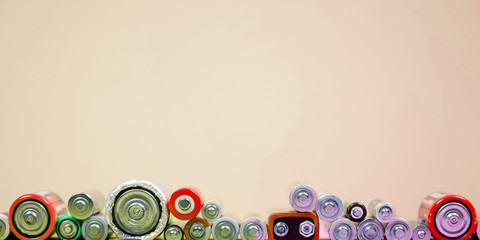 Many different types used or new battery, rechargeable accumulator, alkaline batteries on color...