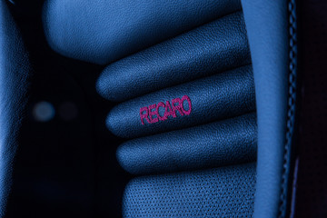 Sports seats Recaro soft leather with durable seam and company red logo