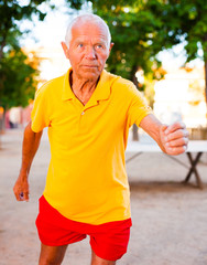 mature man jogging in park