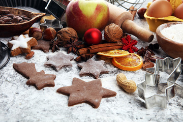 Baking christmas cookies. Typical cinnamon stars bakery with spices. xmas decoration on table
