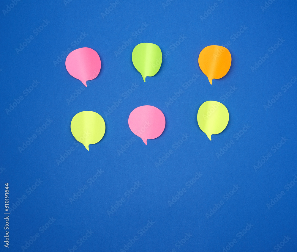 Poster multicolored empty paper stickers in the form of clouds on a blue background