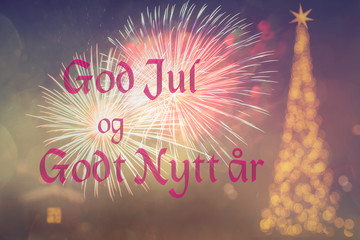 "God Jul och Godt Nytt ar" means "Merry Christmas and Happy New Year" in Norwegian. Blurred background of beautiful decorated Christmas tree with golden lights. Fireworks. Bokeh. 2020 Greeting Norway 