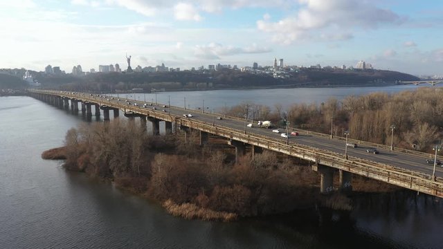 Beautiful Aerial View of City Traffic on the Bridge at the Sunny Day in winter.