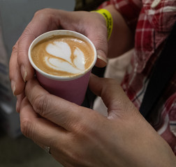Holding a coffee