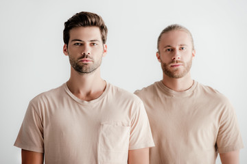 young handsome men in beige outfit isolated on white