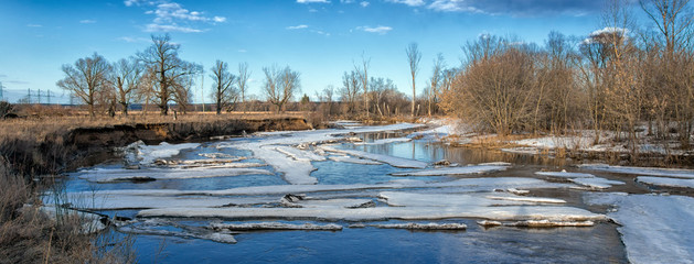 Fototapeta na wymiar Ice drift on the river. Spring sunny day