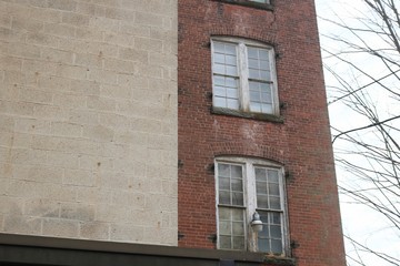 Old abandoned brick factory clock tower industrial vacant building with clock 