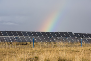 rainbow and photovoltaic panels of solar power station