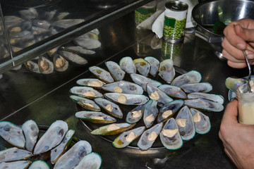 Large open shells of boiled mussels