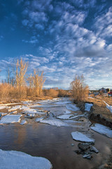 Fototapeta na wymiar Ice drift on the river. Spring sunny day