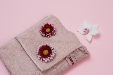 Soft terry towel with flowers on pink background.