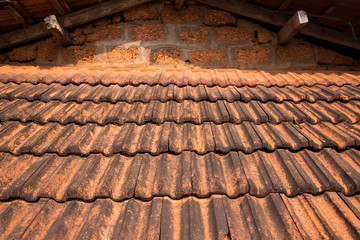 Fragment of a tiled roof on an old building
