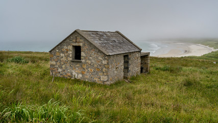 Abandoned building along coastline, Mullet Peninsula, Binghamstown, Erris, County Mayo, Ireland