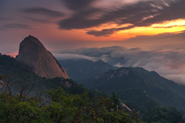 Fototapeta na wymiar Sunrise at Baegundae peak and Bukhansan mountains in Seoul,South Korea...