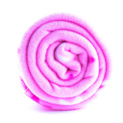 rolled up pink colorful fleece blankets close up