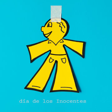 paper doll and text dia de los inocentes