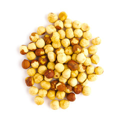 Heap of roasted hazelnut isolated on white background