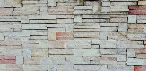Pattern of rough brick wall for background in vintage tone. Art wallpaper and Architecture Exterior design concept 