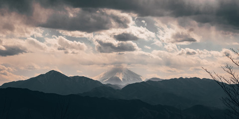 Mount Fuji seen from Mount Takao in spring with clouds