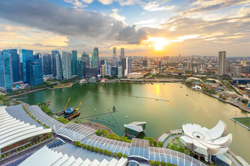 Fototapeta na wymiar Aerial view of cloudy sunrise at Marina Bay Singapore city skyline