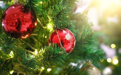 Blurry of Christmas and New Year's balls with beautiful decorations on the Christmas tree, soft light, beautiful background images and illustrations.