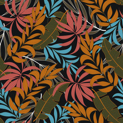 Original seamless tropical pattern with bright orange and pink plants and leaves on a dark background. Beautiful print with hand drawn exotic plants. Trendy summer Hawaii print.