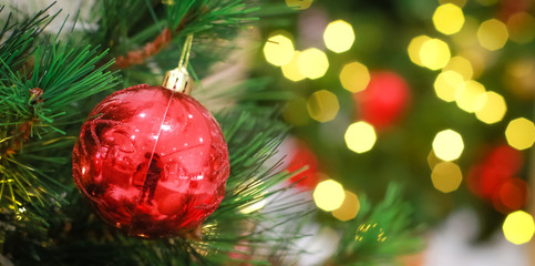 Blurry of Christmas and New Year's balls with beautiful decorations on the Christmas tree, soft light, beautiful background images and illustrations.