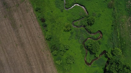 Farm Next to Winding Creek (birds eye drone view)