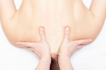 Fototapeta premium Massage and body care. Spa body massage woman hands treatment. Woman having massage in the spa salon for girl