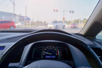  the driver holding steering wheel in the car.