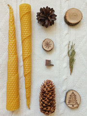 Nuts and candles on a winter sweater