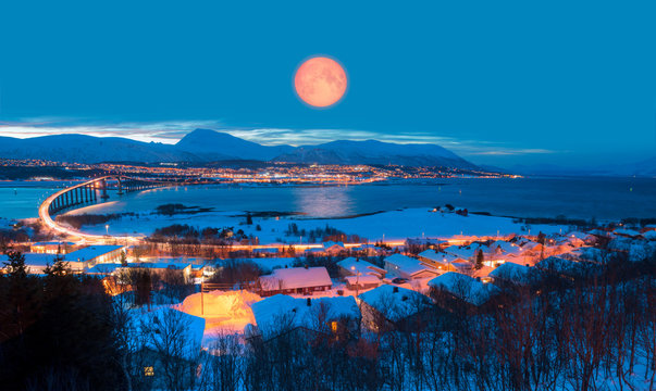 Urban landscape of Tromso in Northern Norway with full moon - Arctic city of Tromso with bridge -Tromso, Norway "Elements of this image furnished by NASA"