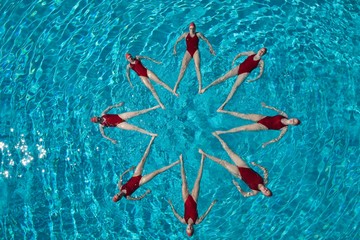 Synchronised Swimmers Forming A Star Shape