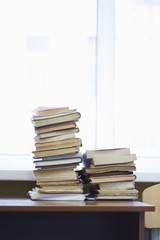 Books Stacked On Desk In Library