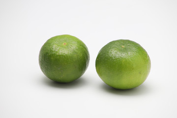 Fresh green lime isolated on white background