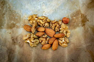 roasted nuts - walnuts, almonds and hazelnuts on parchment