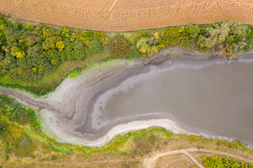 Declining water levels in freshwater due to global warming.
