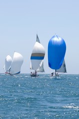 Fototapeta premium Sailboats Racing In The Blue Ocean Against Sky