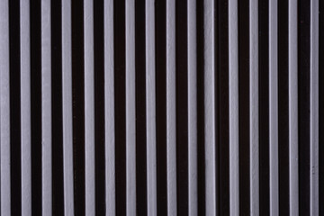 background of dark and light stripes arranged vertically
