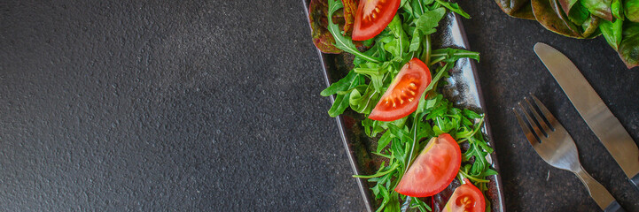 Healthy salad, tomato, leaves mix salad (mix micro greens, onion, other ingredients). food background. copy space